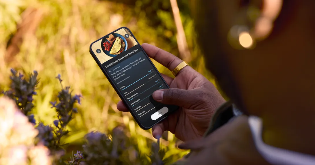 
  Person holding a phone that has food on the screen
